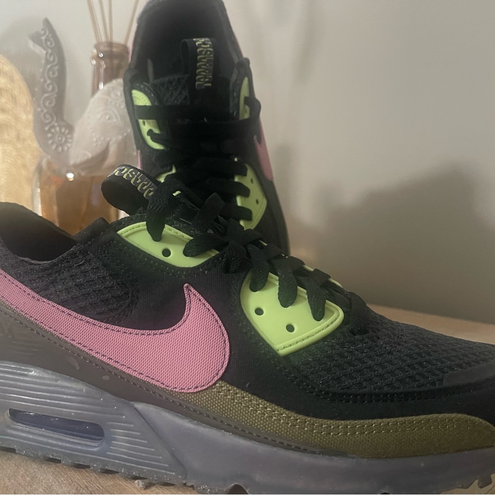 Nike brand black base awesome mauve and green accents.